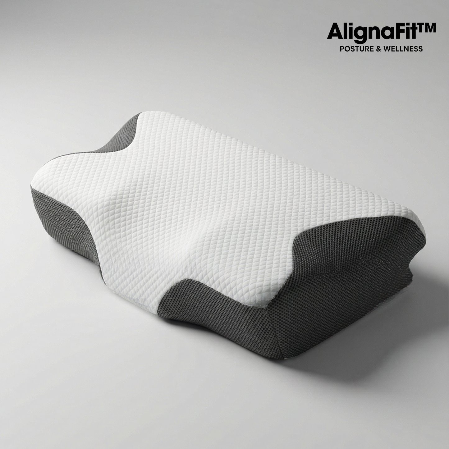 AlignaFit Orthopedic Neck Pillow on bed showing dual-zone shape for side and back sleepers